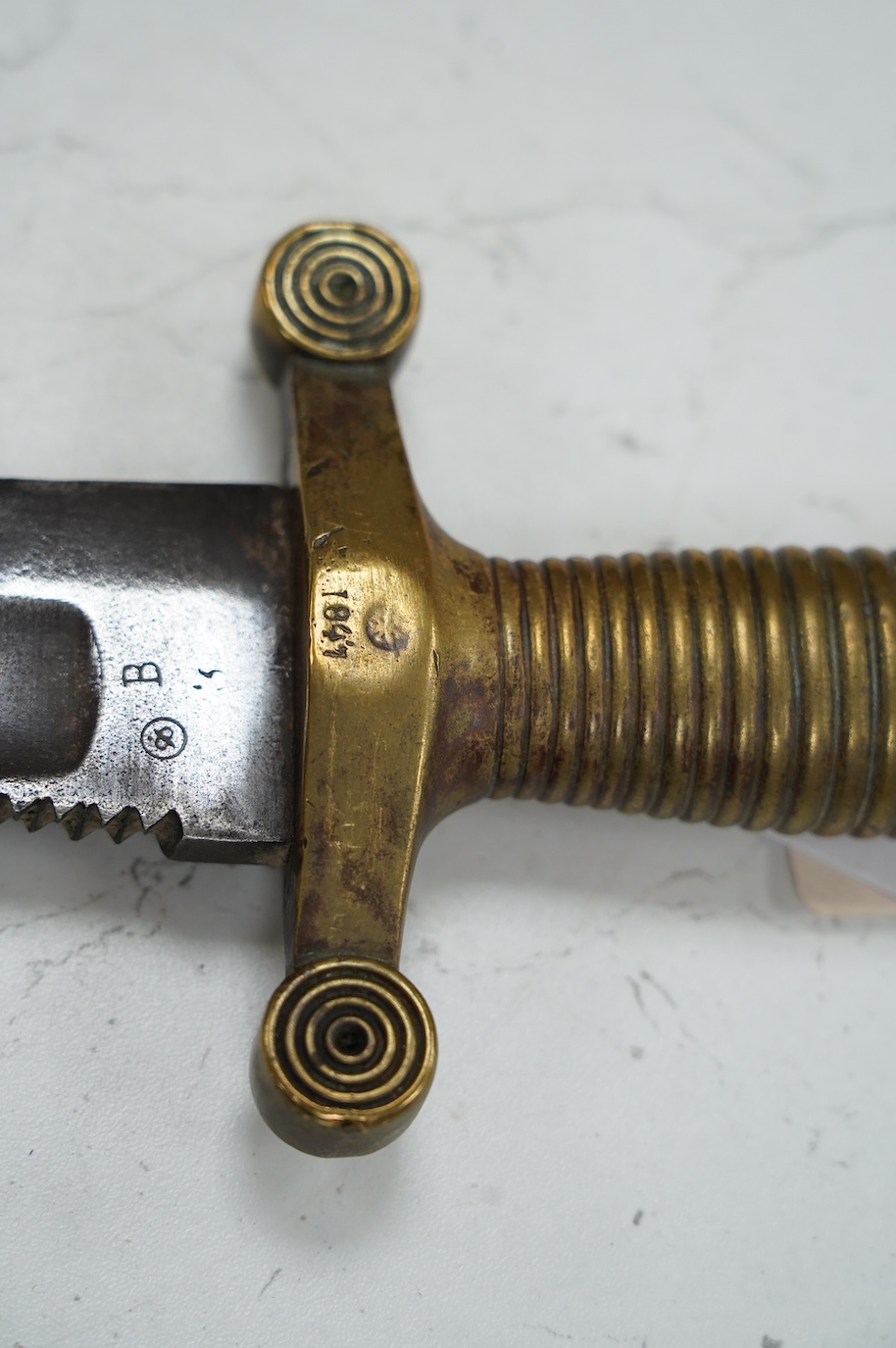 An 1847 Russian pioneer short sword, based on the French 1831 Gladius, with saw back edge, blade 48cm. Condition - good